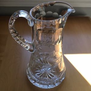 Antique carved glass serving pitcher
